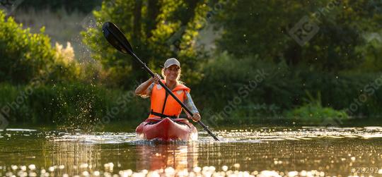 Happy man has fun on a kayak tour on a river  : Stock Photo or Stock Video Download rcfotostock photos, images and assets rcfotostock | RC Photo Stock.: