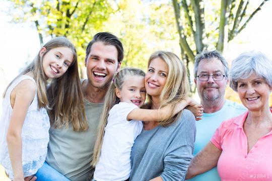 Happy multi-generational family enjoying a sunny day outdoors, smiling and bonding together with children and grandparents in a natural park setting  : Stock Photo or Stock Video Download rcfotostock photos, images and assets rcfotostock | RC Photo Stock.: