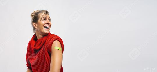 Happy Vaccinated Woman Showing Arm With Green Plaster Bandage After Covid-19 Vaccine Injection, looking away, Coronavirus Vaccination Advertisement Concept Image, Copy Space Banner Gray Background  : Stock Photo or Stock Video Download rcfotostock photos, images and assets rcfotostock | RC Photo Stock.: