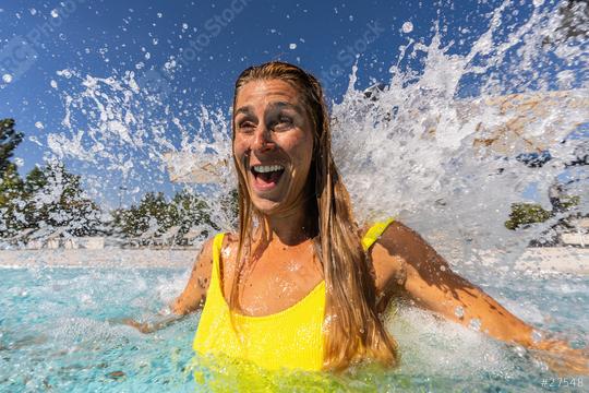 Happy woman enjoying hydrotherapy and splashing water stream of a waterfall in spa pool  : Stock Photo or Stock Video Download rcfotostock photos, images and assets rcfotostock | RC Photo Stock.: