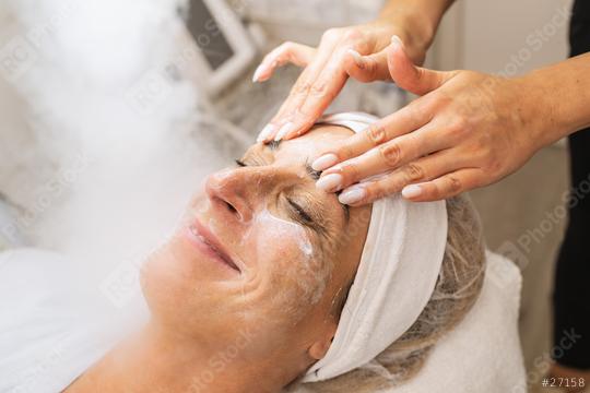 Happy woman has beauty treatment of face with ozone facial steamer and massage in beauty salon.  : Stock Photo or Stock Video Download rcfotostock photos, images and assets rcfotostock | RC Photo Stock.: