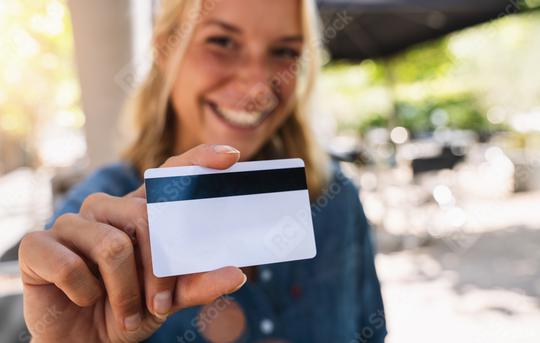 Happy young woman shows  credit card in a cafe  : Stock Photo or Stock Video Download rcfotostock photos, images and assets rcfotostock | RC Photo Stock.: