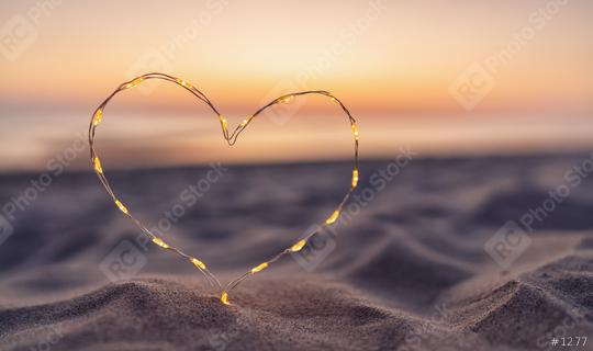 Heart shape made of led lights at the beach sand  : Stock Photo or Stock Video Download rcfotostock photos, images and assets rcfotostock | RC Photo Stock.: