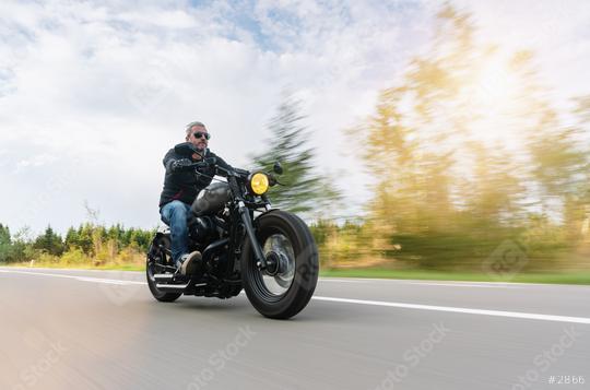 High power motorcycle chopper on the country road riding. having fun driving the empty road on a motorcycle tour  : Stock Photo or Stock Video Download rcfotostock photos, images and assets rcfotostock | RC Photo Stock.: