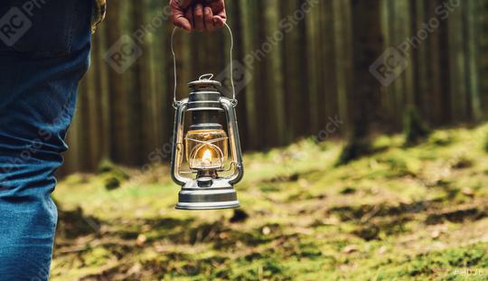 hiker holding a Old oil lamp in the forest. copyspace for your individual text.   : Stock Photo or Stock Video Download rcfotostock photos, images and assets rcfotostock | RC Photo Stock.: