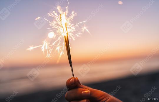 holding sparklers at beach  : Stock Photo or Stock Video Download rcfotostock photos, images and assets rcfotostock | RC Photo Stock.:
