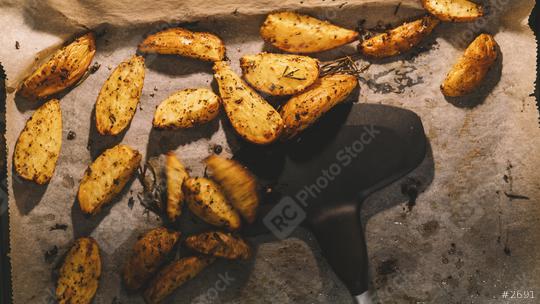homemade Baked potato wedges with rosemary and oil  : Stock Photo or Stock Video Download rcfotostock photos, images and assets rcfotostock | RC Photo Stock.: