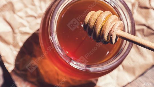 Honey jar with dipper on paper background  : Stock Photo or Stock Video Download rcfotostock photos, images and assets rcfotostock | RC Photo Stock.: