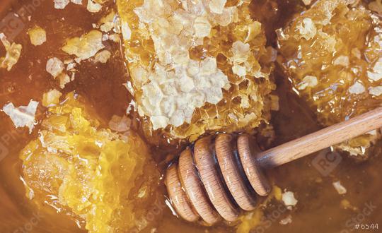 Honeycombs with Honey dipper  : Stock Photo or Stock Video Download rcfotostock photos, images and assets rcfotostock | RC Photo Stock.: