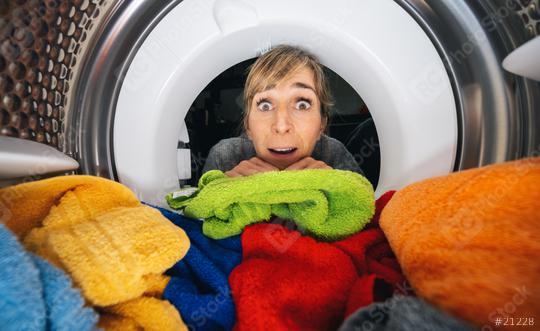 Housewife Reaching Inside a washing machine or dryer at Home view from washing machine inside  : Stock Photo or Stock Video Download rcfotostock photos, images and assets rcfotostock | RC Photo Stock.: