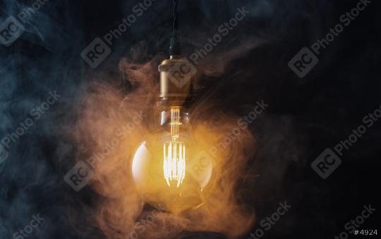 illuminated Vintage hanging light bulb with steamysmoke  : Stock Photo or Stock Video Download rcfotostock photos, images and assets rcfotostock | RC Photo Stock.: