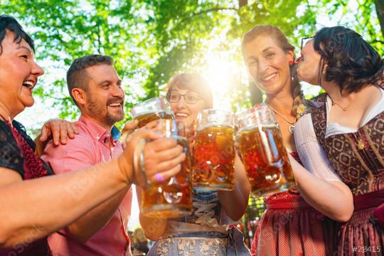 In Beer garden in Bavaria, Germany - friends in Tracht, Dindl and Lederhosen and Dirndl standing in Bavarian beer garden or oktoberfest  : Stock Photo or Stock Video Download rcfotostock photos, images and assets rcfotostock | RC Photo Stock.: