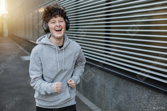 Jogger laughs a lot and is happy. Sporty person is motivated.  : Stock Photo or Stock Video Download rcfotostock photos, images and assets rcfotostock | RC Photo Stock.: