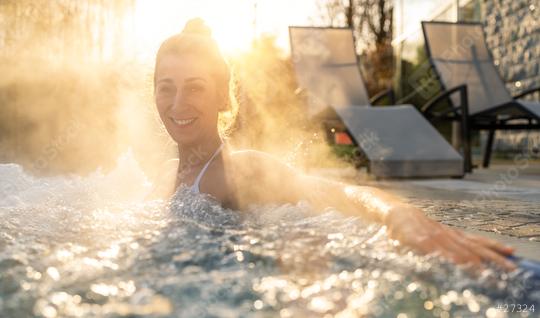 Joyful woman in a hot tub with steam and sunlight  : Stock Photo or Stock Video Download rcfotostock photos, images and assets rcfotostock | RC Photo Stock.: