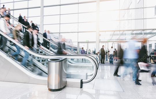 large crowd of blurred people rushing on escalators at a trade fair hall  : Stock Photo or Stock Video Download rcfotostock photos, images and assets rcfotostock | RC Photo Stock.: