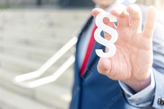 lawyer holding paragraph symbol - law concept image  : Stock Photo or Stock Video Download rcfotostock photos, images and assets rcfotostock | RC Photo Stock.: