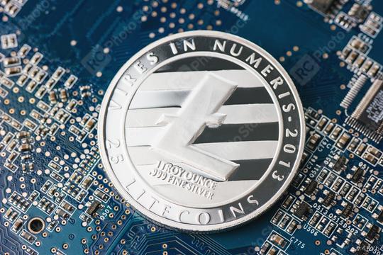 Litecoin new digital cryptocurrency on mainboard  : Stock Photo or Stock Video Download rcfotostock photos, images and assets rcfotostock | RC Photo Stock.: