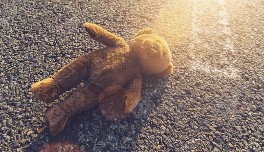 Lost teddy bear lying alone on the road  : Stock Photo or Stock Video Download rcfotostock photos, images and assets rcfotostock | RC-Photo-Stock.: