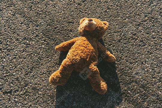 Lost teddy bear lying on the street after an accident, with skidmarks   : Stock Photo or Stock Video Download rcfotostock photos, images and assets rcfotostock | RC Photo Stock.: