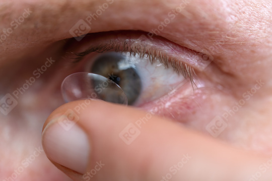 Macro shot of an eye with a contact lens being applied by a fing  : Stock Photo or Stock Video Download rcfotostock photos, images and assets rcfotostock | RC Photo Stock.: