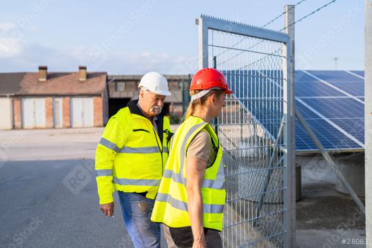 Male and female engineers at a solar power plant gate to inspection  : Stock Photo or Stock Video Download rcfotostock photos, images and assets rcfotostock | RC Photo Stock.: