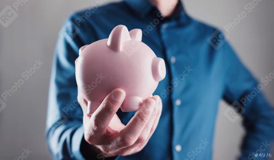 Male hand holding a piggy bank  : Stock Photo or Stock Video Download rcfotostock photos, images and assets rcfotostock | RC Photo Stock.: