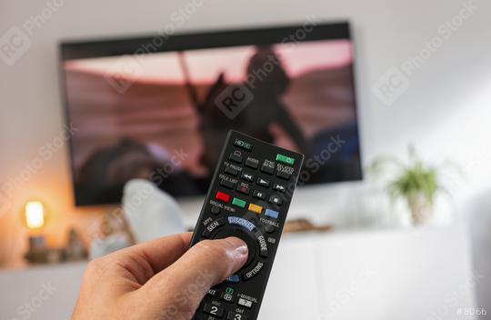 Male hand holding TV remote control and Watch tv  : Stock Photo or Stock Video Download rcfotostock photos, images and assets rcfotostock | RC Photo Stock.: