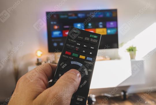 Male hand holding TV remote control, Point of view shot  : Stock Photo or Stock Video Download rcfotostock photos, images and assets rcfotostock | RC Photo Stock.: