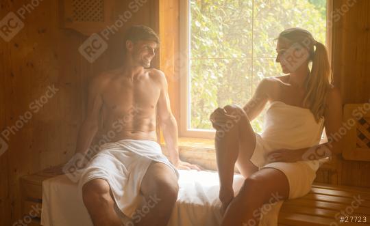 Man and woman sitting in finnish sauna, smiling at each other wrapped in towels. Spa Wellness hotel Concept image  : Stock Photo or Stock Video Download rcfotostock photos, images and assets rcfotostock | RC Photo Stock.: