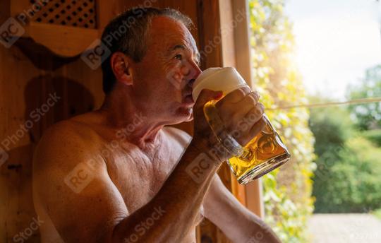 Man drinking german beer in bavarian sauna, sunlight through window. Spa Wellness  hotel concept image  : Stock Photo or Stock Video Download rcfotostock photos, images and assets rcfotostock | RC Photo Stock.: