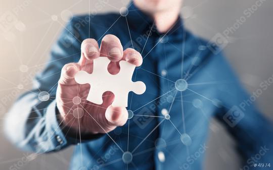 Man Hand Holding Puzzle Piece  : Stock Photo or Stock Video Download rcfotostock photos, images and assets rcfotostock | RC Photo Stock.: