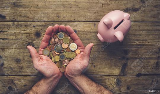 man hands holding a heap of euro coins with piggy bank, top view  : Stock Photo or Stock Video Download rcfotostock photos, images and assets rcfotostock | RC Photo Stock.: