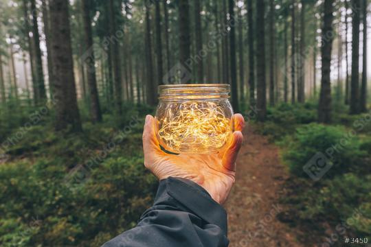 man hold a Transparent jar with lights from led in a misty forest. Romantic Hipster Concept image  : Stock Photo or Stock Video Download rcfotostock photos, images and assets rcfotostock | RC Photo Stock.: