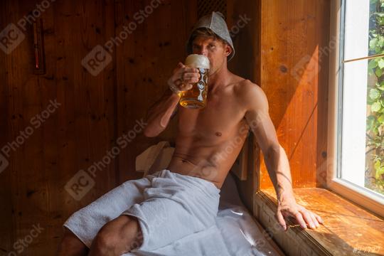 Man in a bavarian sauna with Finnish felt hat drinking german beer mug and bathed in sunlight, relaxed oktoberfest concept image  : Stock Photo or Stock Video Download rcfotostock photos, images and assets rcfotostock | RC Photo Stock.: