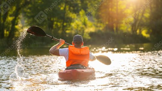 man is kayaking on the river at a summer day  : Stock Photo or Stock Video Download rcfotostock photos, images and assets rcfotostock | RC Photo Stock.: