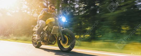 man on a motorbike on the road riding. having fun driving the empty road on a motorcycle tour journey. copyspace for your individual text.  : Stock Photo or Stock Video Download rcfotostock photos, images and assets rcfotostock | RC Photo Stock.: