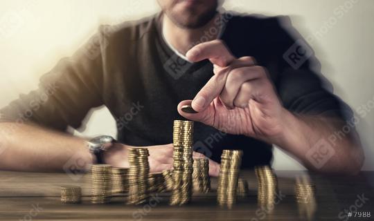 man rising coins on stacks  : Stock Photo or Stock Video Download rcfotostock photos, images and assets rcfotostock | RC Photo Stock.: