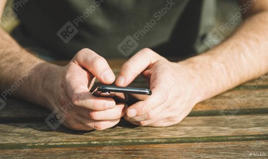 man typing on smart phone  : Stock Photo or Stock Video Download rcfotostock photos, images and assets rcfotostock | RC Photo Stock.: