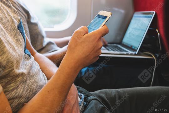 Man use Smartphone in train  : Stock Photo or Stock Video Download rcfotostock photos, images and assets rcfotostock | RC Photo Stock.: