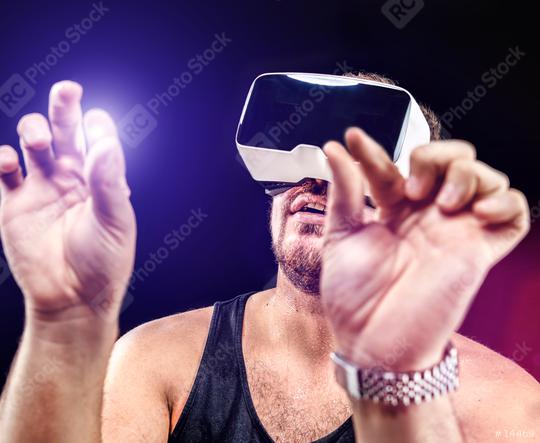 Man uses Virtual Realitiy VR head-mounted display  : Stock Photo or Stock Video Download rcfotostock photos, images and assets rcfotostock | RC Photo Stock.: