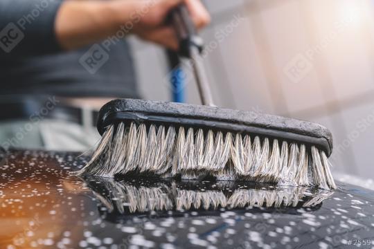 man using a brush to wash a car   : Stock Photo or Stock Video Download rcfotostock photos, images and assets rcfotostock | RC Photo Stock.: