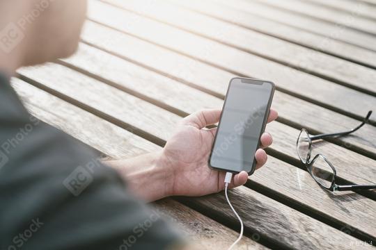 man using a smart phone in his outdoor office  : Stock Photo or Stock Video Download rcfotostock photos, images and assets rcfotostock | RC Photo Stock.:
