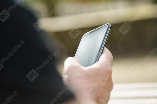 man using his Mobile Phone in the street  : Stock Photo or Stock Video Download rcfotostock photos, images and assets rcfotostock | RC Photo Stock.: