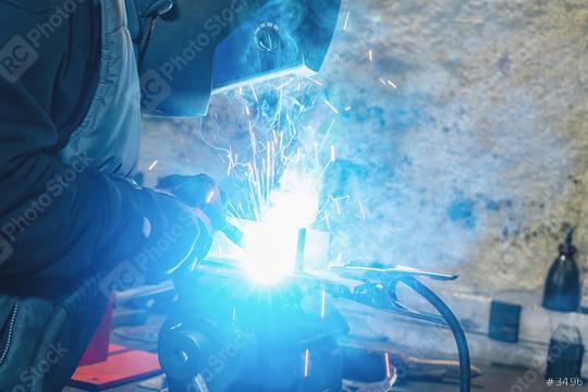 man welds at the factory  : Stock Photo or Stock Video Download rcfotostock photos, images and assets rcfotostock | RC Photo Stock.:
