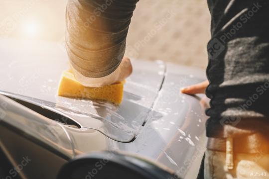 Man worker hold sponge for washing car  : Stock Photo or Stock Video Download rcfotostock photos, images and assets rcfotostock | RC Photo Stock.: