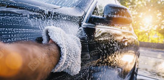 Man worker washing black SUV with sponge on a car wash.  : Stock Photo or Stock Video Download rcfotostock photos, images and assets rcfotostock | RC Photo Stock.: