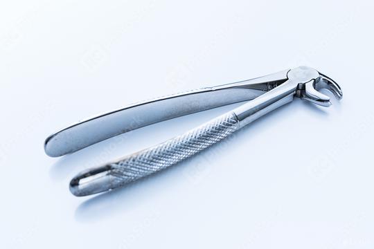 Mandibular wisdom tooth forceps for dentist visiting  : Stock Photo or Stock Video Download rcfotostock photos, images and assets rcfotostock | RC Photo Stock.: