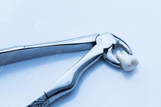 Mandibular wisdom tooth forceps from dentist  : Stock Photo or Stock Video Download rcfotostock photos, images and assets rcfotostock | RC Photo Stock.: