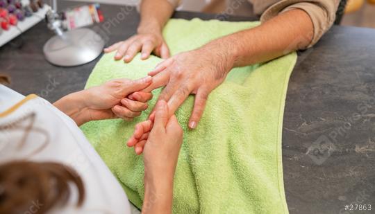 Manicurist massaging client