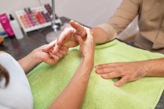 Manicurist massaging male hands of a client after a manicure session. body care spa treatment concept image  : Stock Photo or Stock Video Download rcfotostock photos, images and assets rcfotostock | RC Photo Stock.: